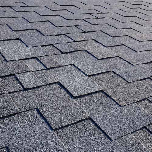 Red brick home with light shingled roof